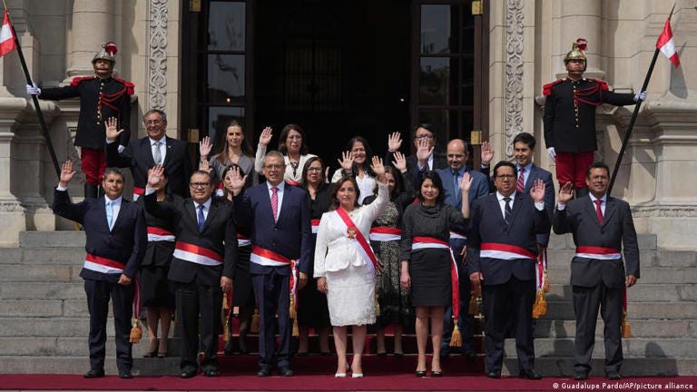 Peruvian President Dina Boluarte, center front, and newly named cabinet members