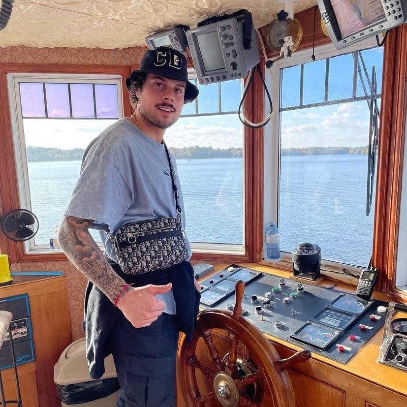 Auston Matthews at the wheel of a ship on Lake Muskoka