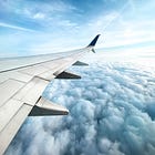 A Dad Walks Onto a Plane with Two Kids in Tow
