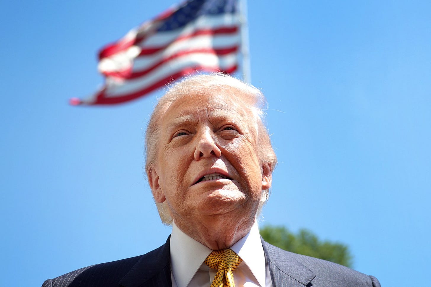 WASHINGTON, DC - MAY 12: U.S. President Donald Trump speaks in front of the American flag to the press as he departs the White House on May 12, 2026 in Washington, DC. Trump is traveling to China where he is scheduled to meet with Chinese President Xi Jinping for expected talks on the Iran conflict, trade imbalances, regional security, and economic cooperation between the two countries. (Photo by Kevin Dietsch/Getty Images) WASHINGTON, DC - MAY 12: U.S. President Donald Trump speaks in front of the American flag to the press as he departs the White House on May 12, 2026 in Washington, DC. Trump is traveling to China where he is scheduled to meet with Chinese President Xi Jinping for expected talks on the Iran conflict, trade imbalances, regional security, and economic cooperation between the two countries. (Photo by Kevin Dietsch/Getty Images)