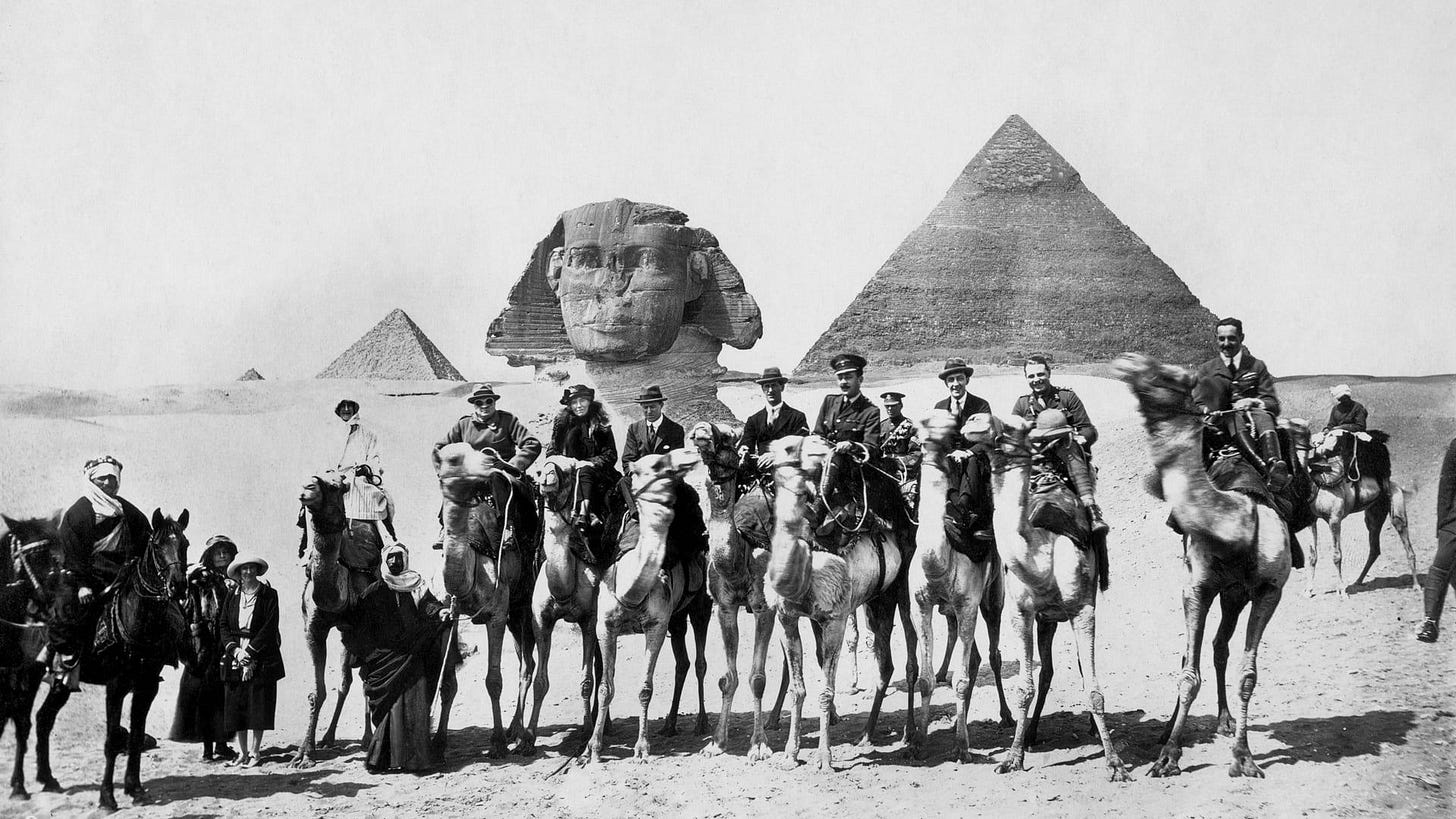 Sphinx, pyramids, people on camels Sphinx, pyramids, people on camels