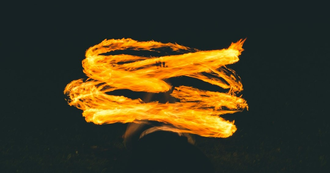a blurry photo of a fire with a black background