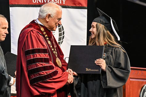Various photos of graduates at Troy University's commencement ceremony.