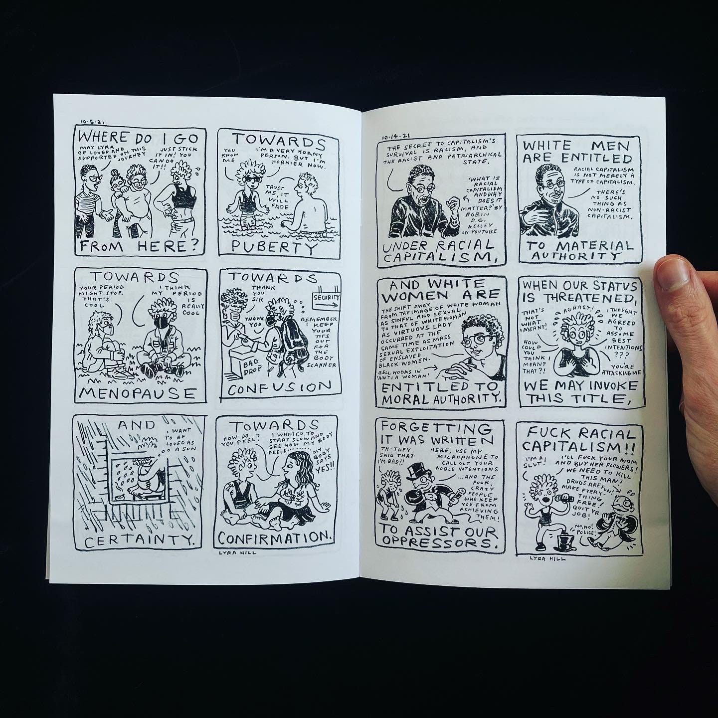 The new zine is open to a page showing two comics.