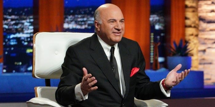 Kevin O'Leary sitting in a white chair and speaking on "Shark Tank."