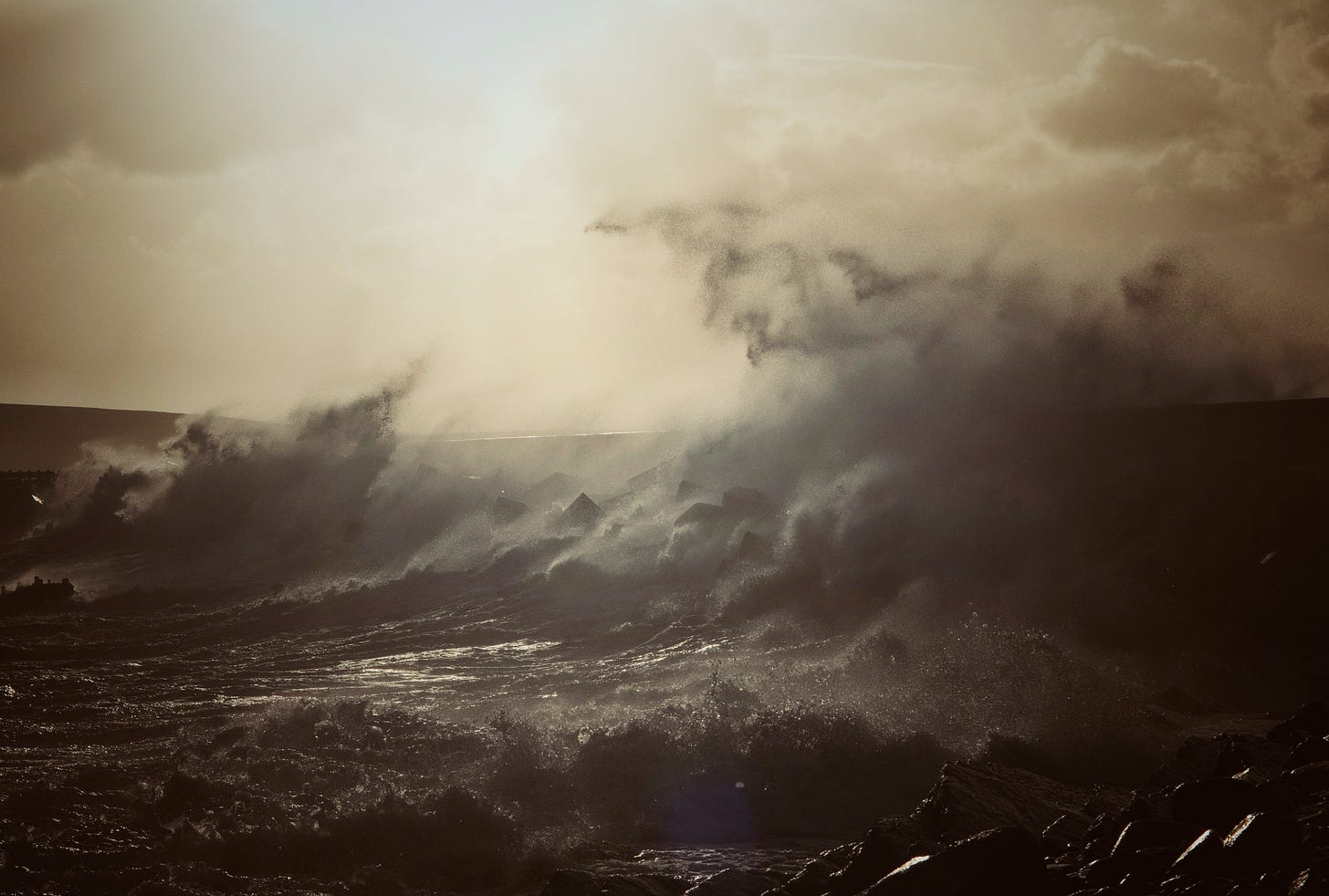 breaking wave in evening light