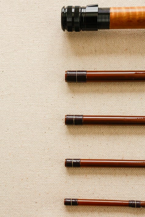 A custom 4wt fiberglass fishing rod with styling inspired by a 1970s Ford Bronco.