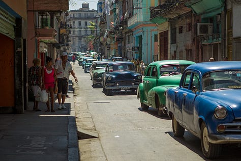 A second 3x3 grid of nine photographs from Havana, Cuba. The images show daily city life, including: kids jumping off the Malecón sea wall, people fishing at sunset, boys playing soccer in the street, classic American cars, a mural of Che Guevara, a dilapidated building, and a street vendor with a fruit cart.