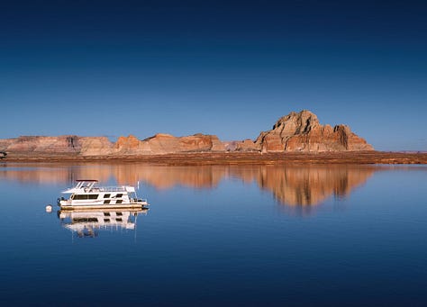 Boat on Lake Powell, ambulance, and beer cans