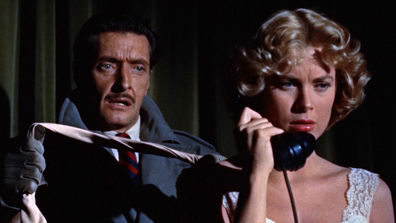 A still from the movie Dial M for Murder. A man stands behind a woman on the phone, intending to strangle her.