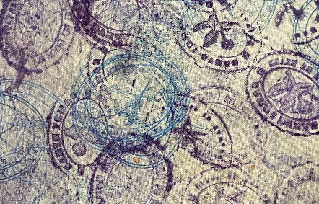 Vintage stamps scattered on textured paper