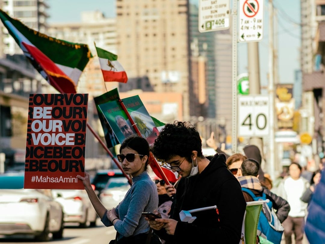 a group of people holding signs