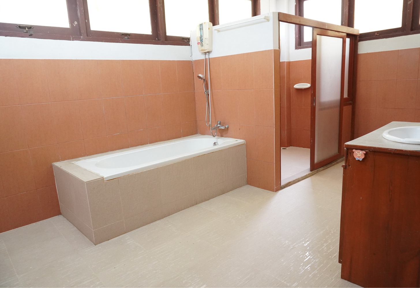 Downstairs bathroom off the third bedroom. All the bedrooms have bathrooms this size, but this is the only one with a tub.