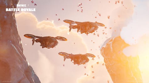 A red and grey sci-fi blaster, a picture of multiple two-blade helicopters flying through an alien invasion, and a cute rolled-up alien.