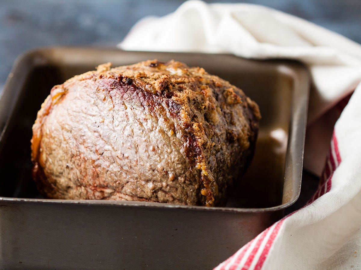 roast topside in roasting tine, with tea towel wrapped around the tin.