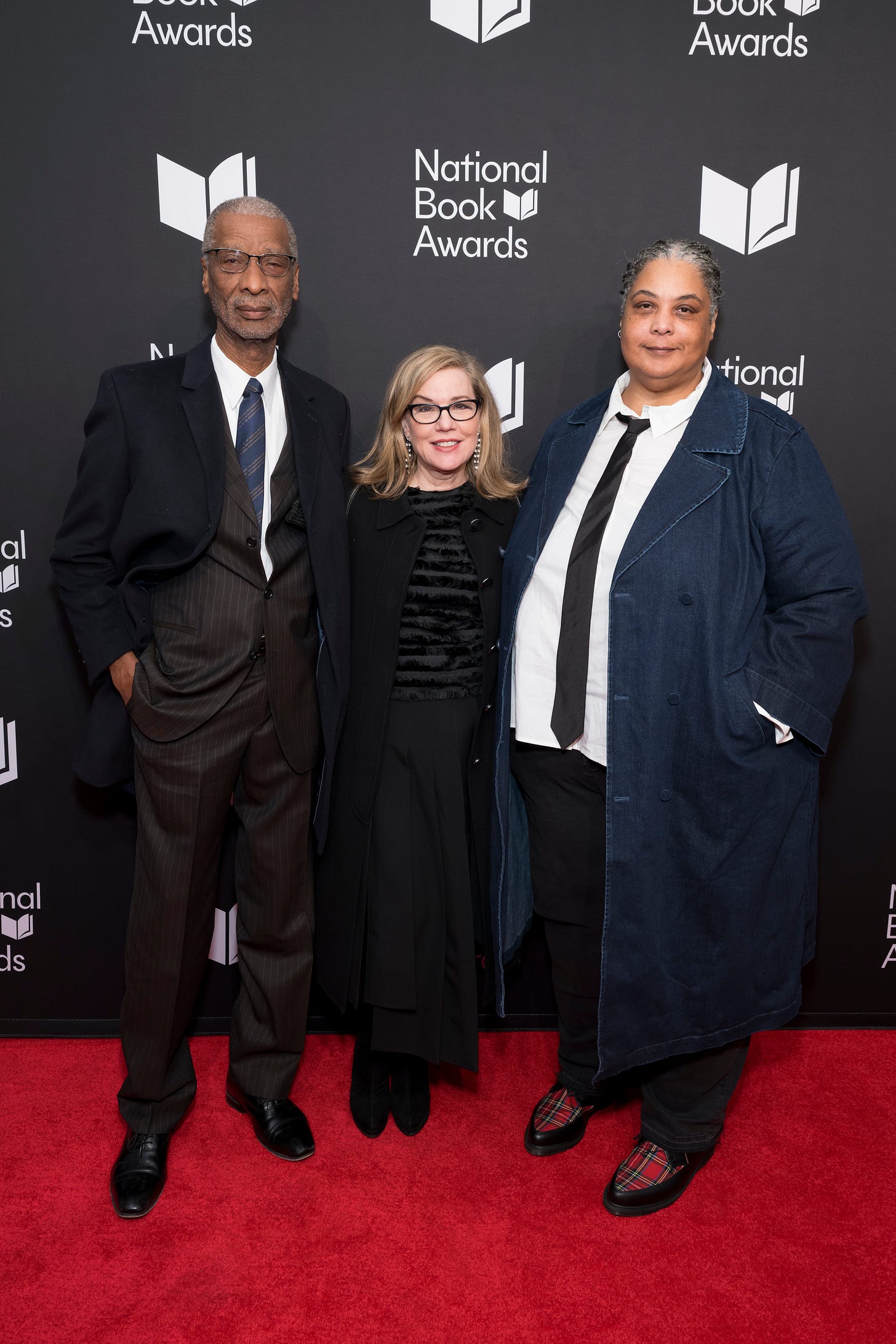 An image of Michael Gay, Roxane Gay, and Debbie Millman in front of National Book Awards logo at the event. 