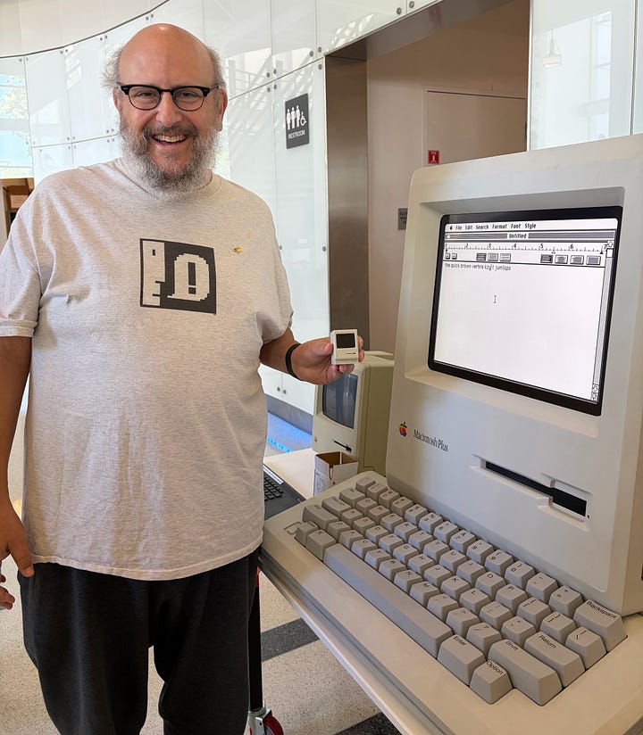 Two photos showing Big Mac, a 4:1 scale regular size replica of a Macintosh Plus, pico-mac-nano, a 62mm-high (1:5.5 scale) working replica of the original Mac, and an actual original Mac for scale. The author is holding the pico-mac-nano in the right-hand photo. Both photos were taken at Apple TechFest at the Computer History Museum.