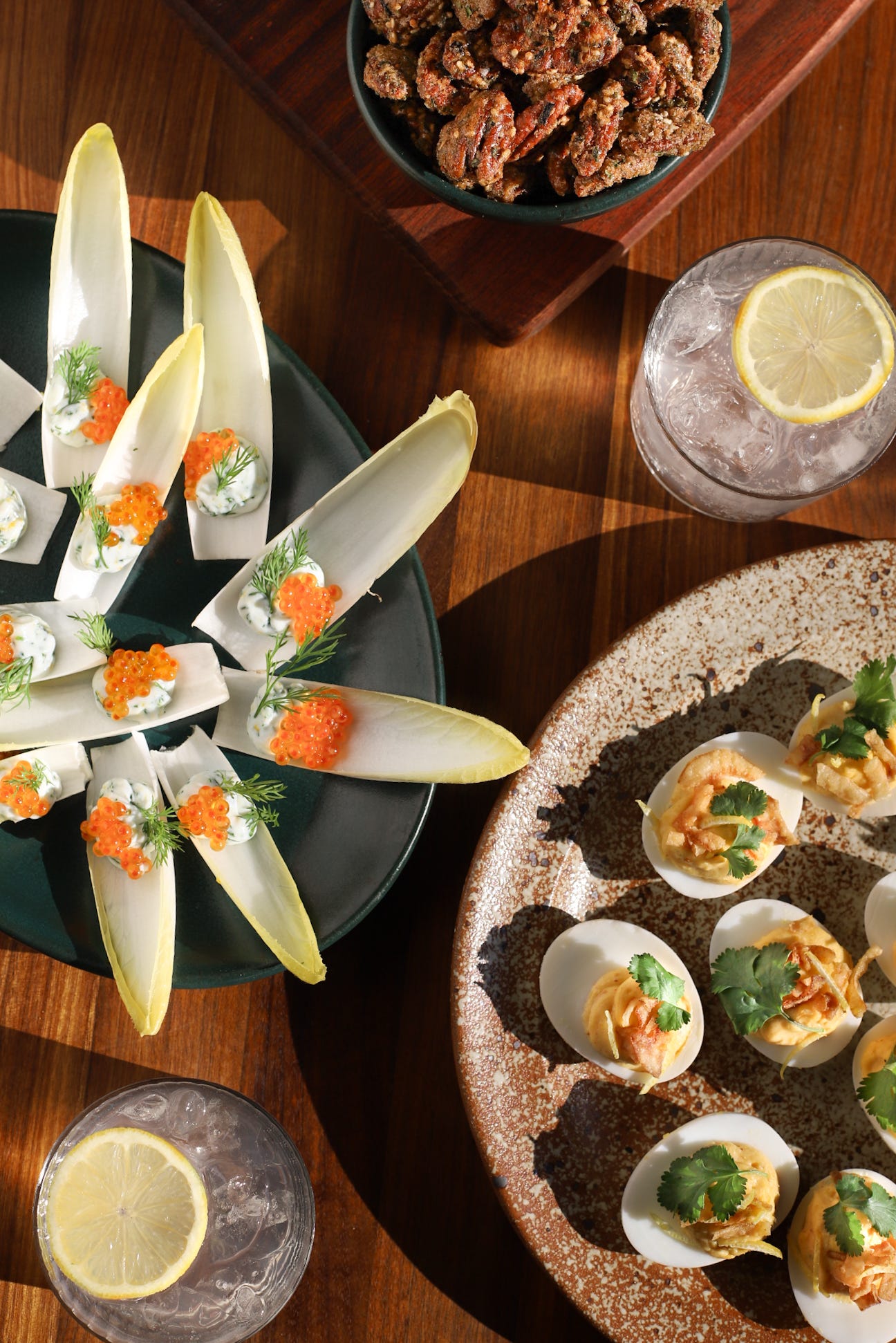 Trio of New Year's Eve bites: candied nuts, endive boats, and deviled eggs
