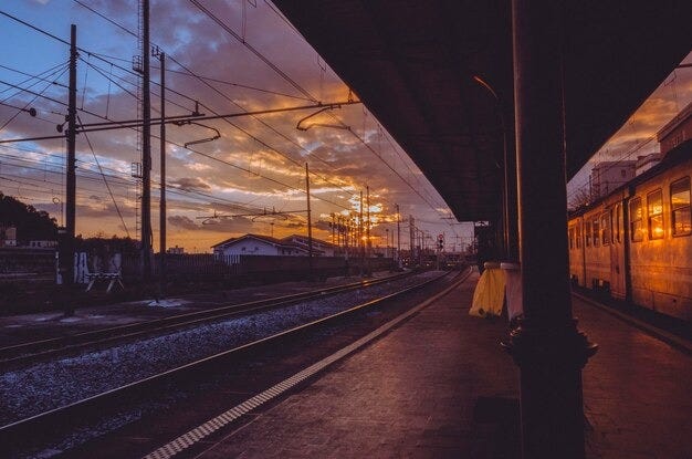 Premium Photo | Railroad station platform at dusk