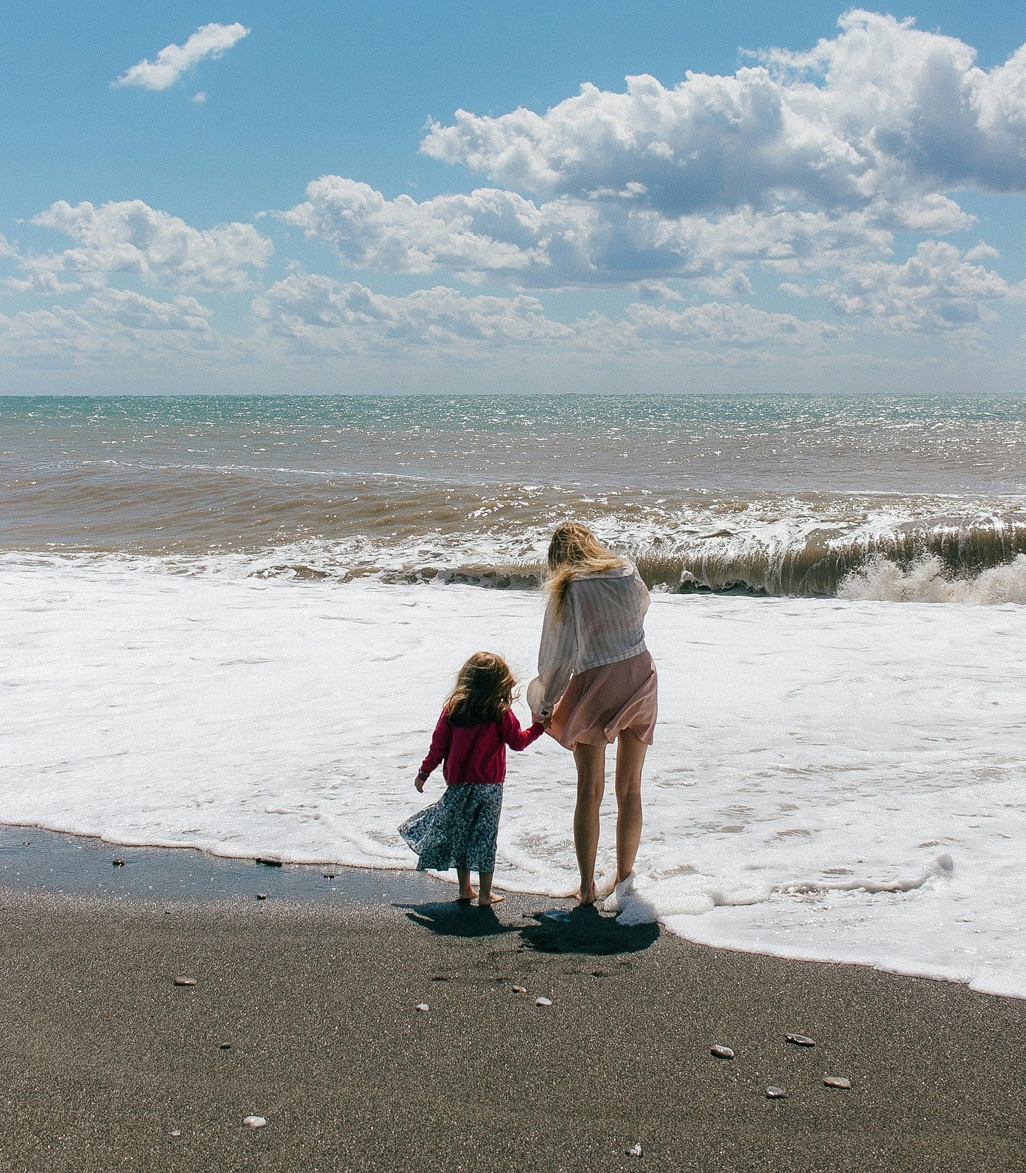 A woman and a child on a beach