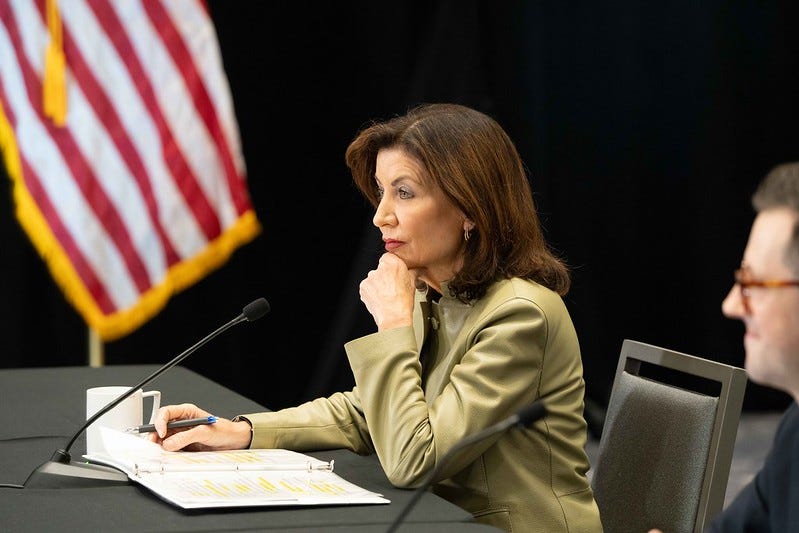 kathy hochul at a table