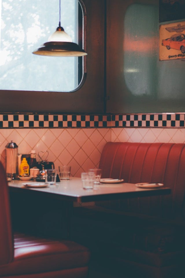 A booth at a retro, 1950s-style American diner. A booth at a retro, 1950s-style American diner.