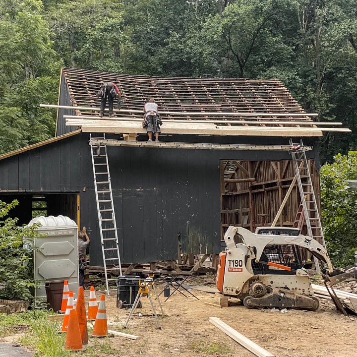 Rebuilding the barn, adding a roof and showing the delicate beams that look like a skeleton of the old barn.