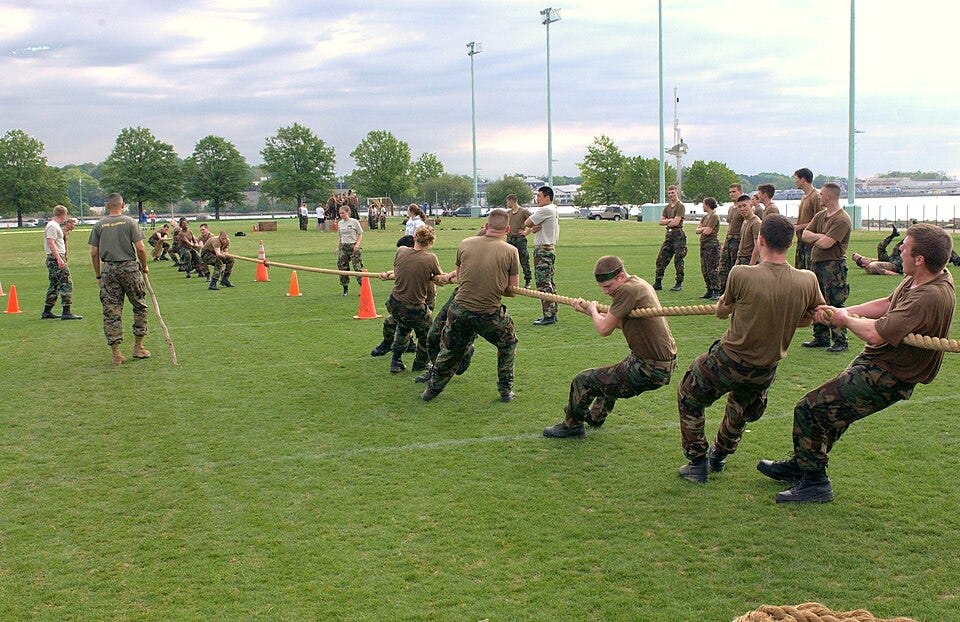 naval academy students competing in a game of tug of war naval academy students competing in a game of tug of war