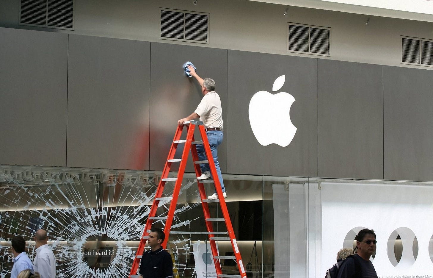 A worker polishes the facade of Apple Eaton Centre shortly before the grand opening. A worker polishes the facade of Apple Eaton Centre shortly before the grand opening.
