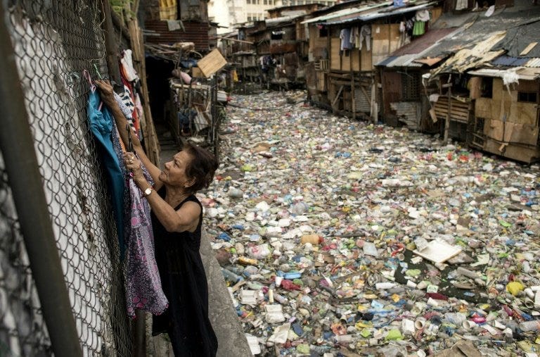 Manila 'trash bin' waterway choked with plastic Manila 'trash bin' waterway choked with plastic