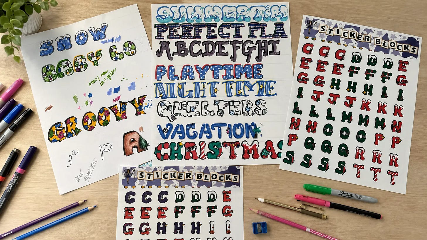 Hand-drawn themed font designs alongside finished commercial sticker sheets arranged on a desk with art supplies