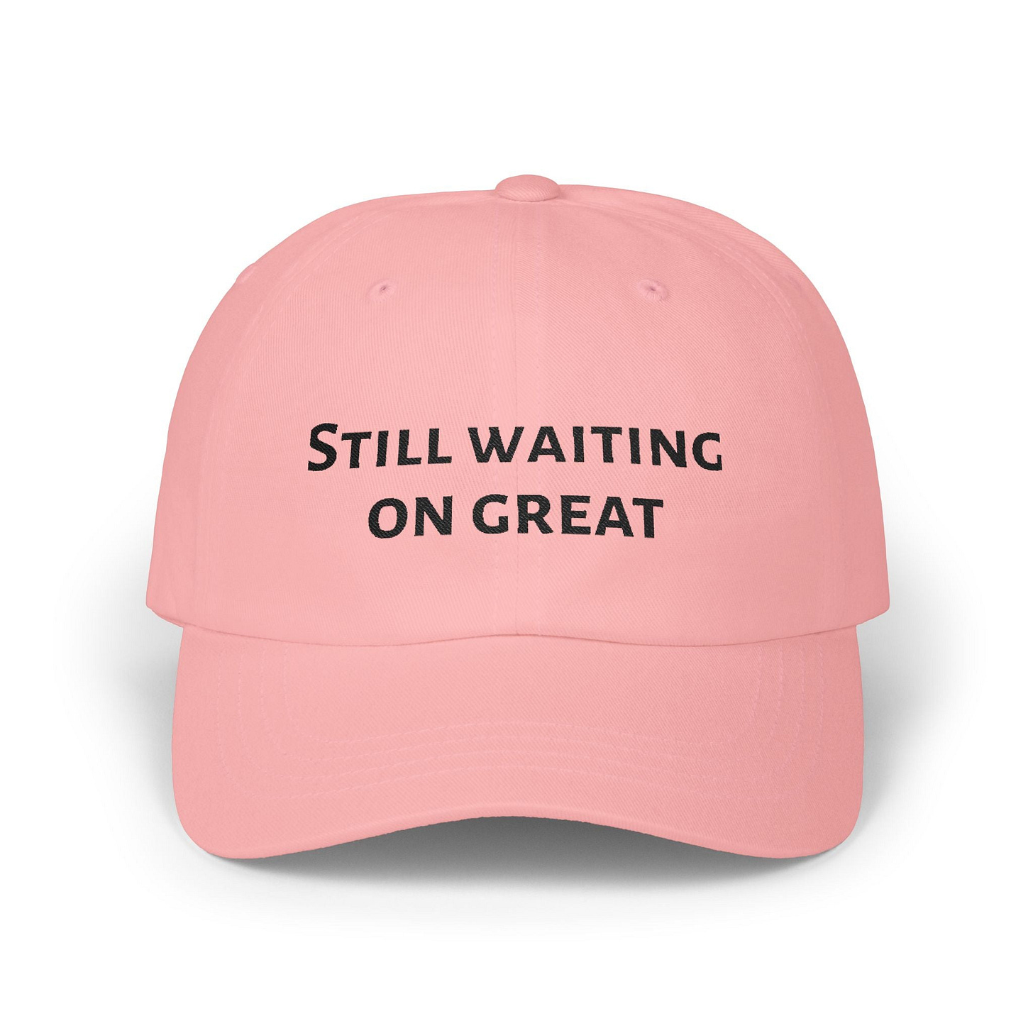 Pink trucker hat that reads Still Waiting On Great.