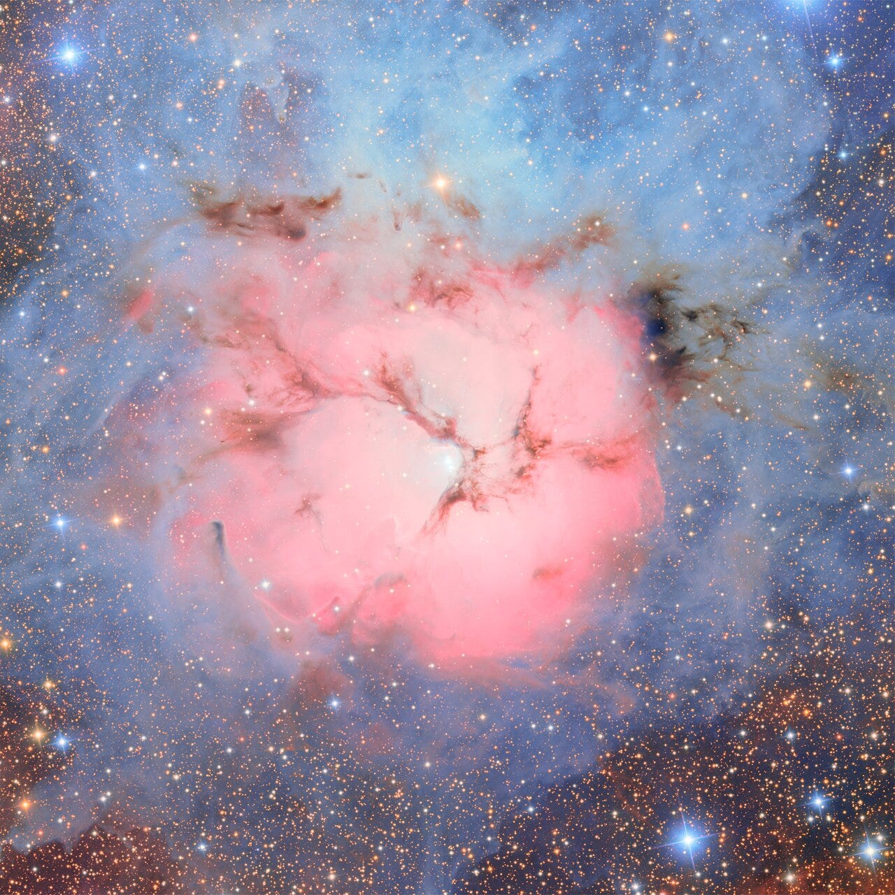an image of a nebula with a round pink cloud in the middle and blue clouds on the outer edges