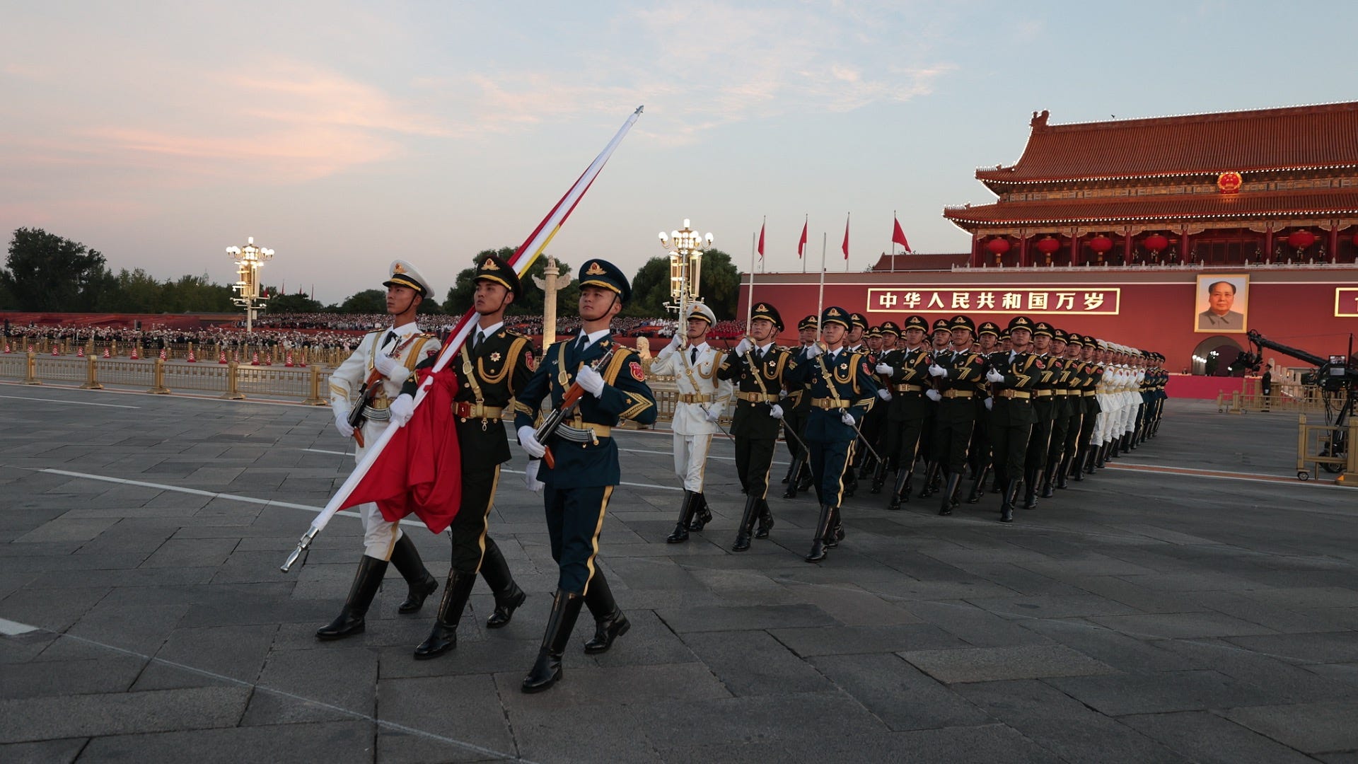 The People’s Liberation Army Honor Guard carries the flag of the People’s Republic of China out onto Tian’anmen Square for the 76th National Day’s flag-raising ceremony. The People’s Liberation Army Honor Guard carries the flag of the People’s Republic of China out onto Tian’anmen Square for the 76th National Day’s flag-raising ceremony.