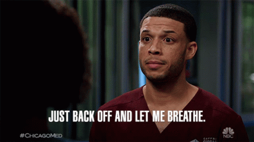 a man says " just back off and let me breathe " while wearing scrubs