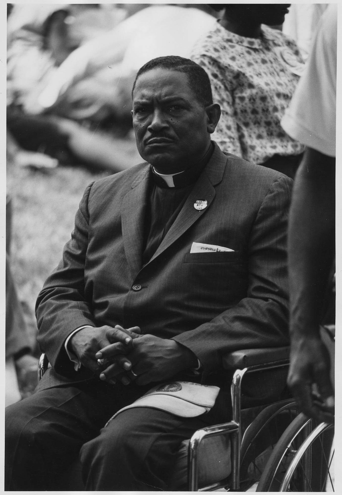 Black-and-white photograph of a man in a wheelchair participating in the 1963 March on Washington.