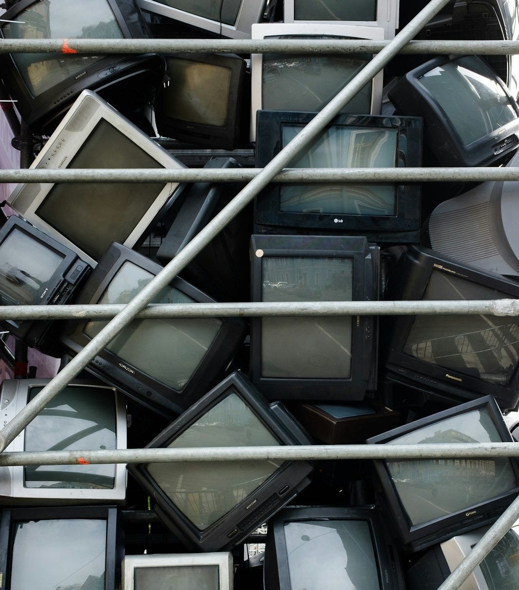 a pile of televisions sitting on top of each other