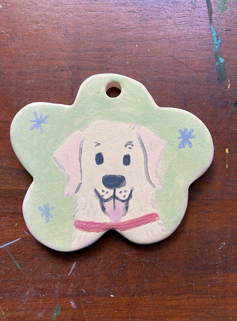 Three ornaments with dog portraits on them