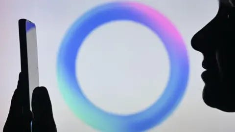 Getty Images A person looking at their phone. Behind them is the blue circle signifying Meta AI.