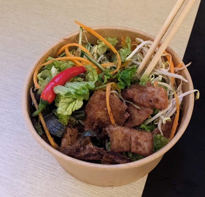 a vermicelli bowl of take out food