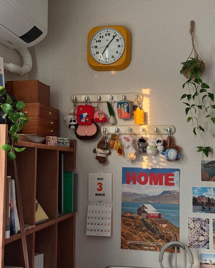 This may contain: there is a clock on the wall above a desk and bookshelf in this room
