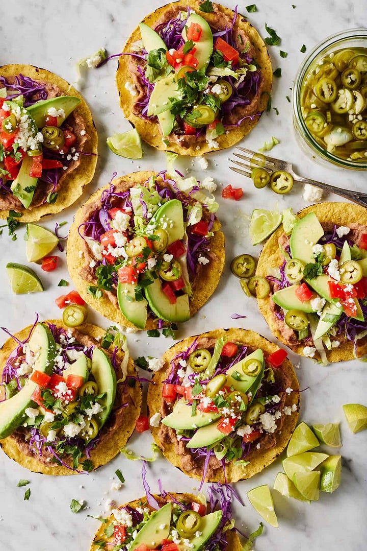 plate of easy Tostadas, a spring roll bowl with peanut sauce, goodies boxed Mac and cheese, Taylor Farms salad wrap, easy recipes made in 30 minutes