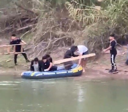 Cartel smuggling:”guides” and migrants prepare to cross the Rio Grande with makeshift ladders to scale the border wall. (US Border Patrol photo) Cartel smuggling:”guides” and migrants prepare to cross the Rio Grande with makeshift ladders to scale the border wall. (US Border Patrol photo)