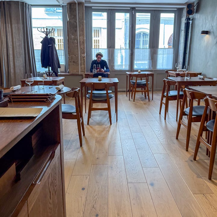 Interior and service at Eme restaurant in Paris