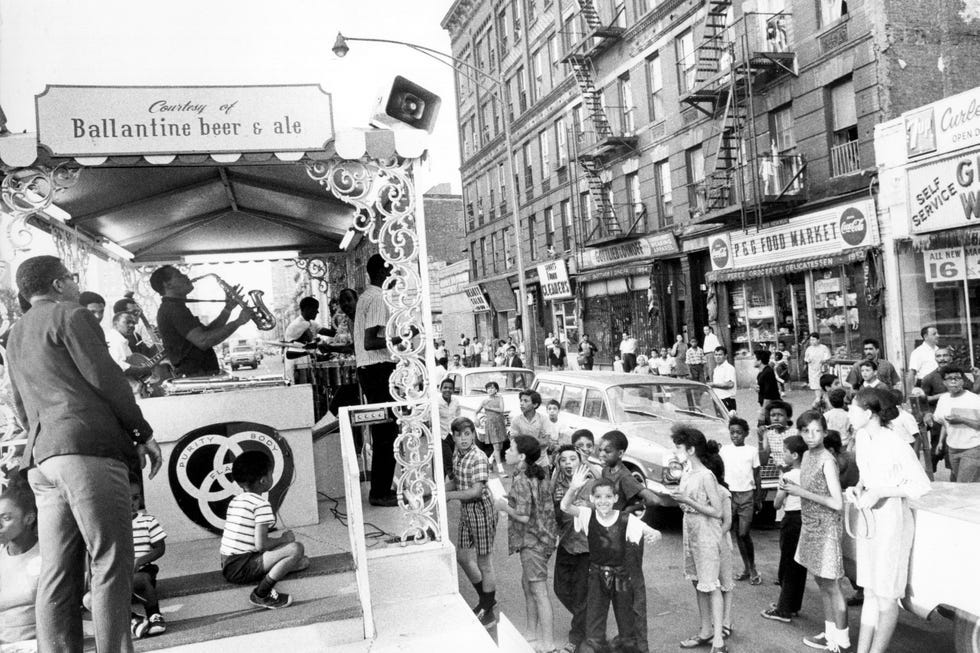 Reflecting the grit and glamour: a street scene in downtown Manhattan, 1970s. Reflecting the grit and glamour: a street scene in downtown Manhattan, 1970s.