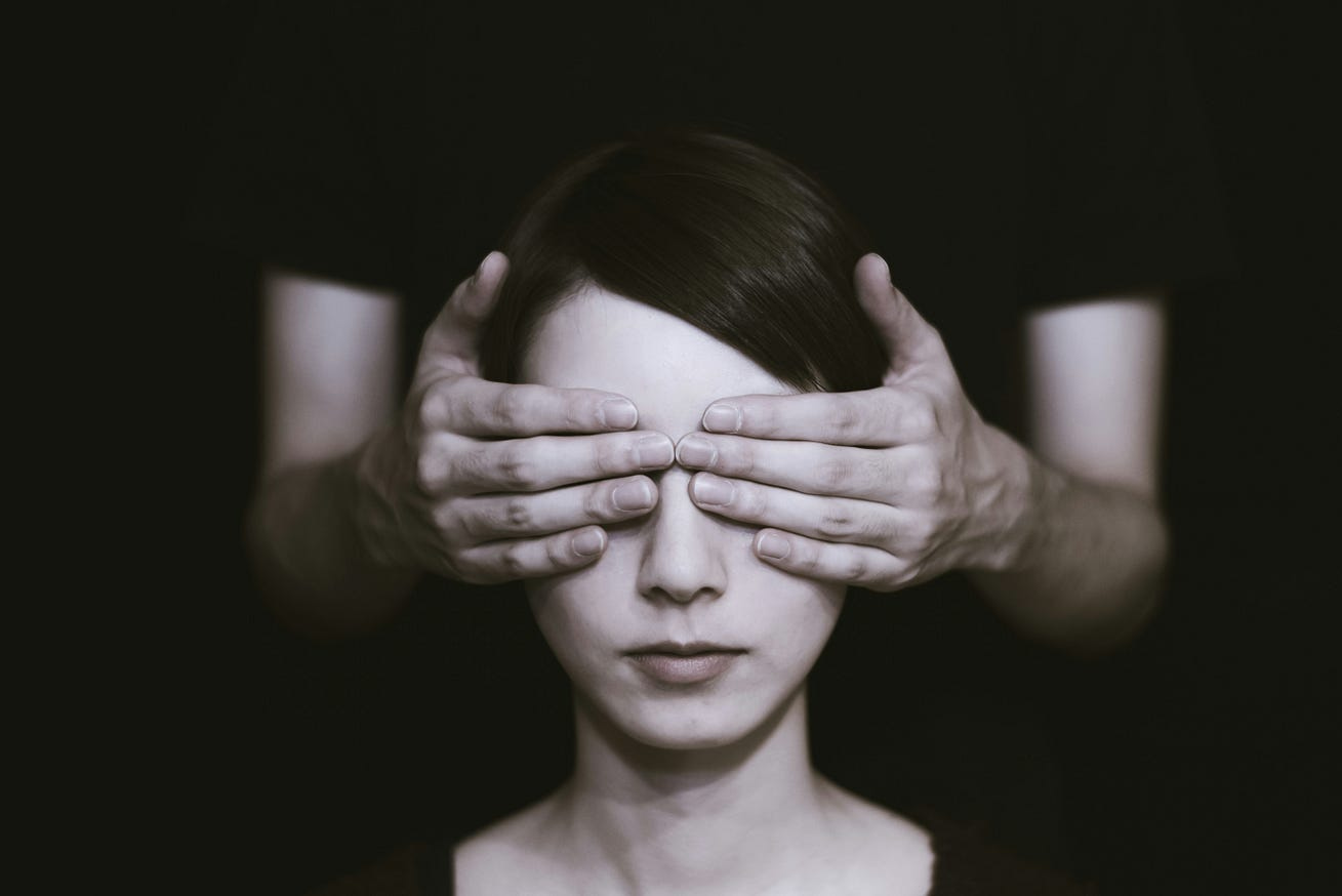 Woman with her eyes coverd by man's hands Woman with her eyes coverd by man's hands