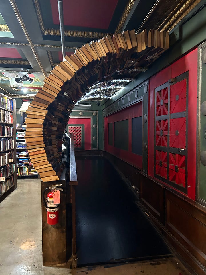 the last bookstore's sign and book arch