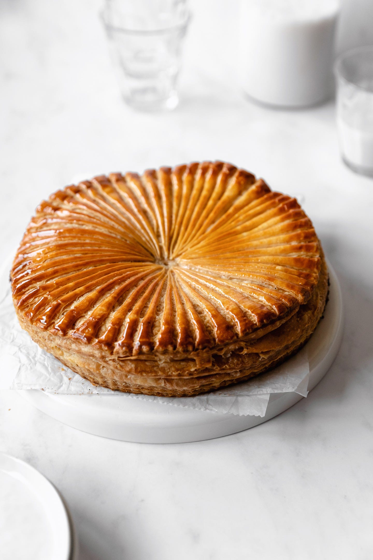 Vegan chocolate bourbon pecan pithiviers on a white background