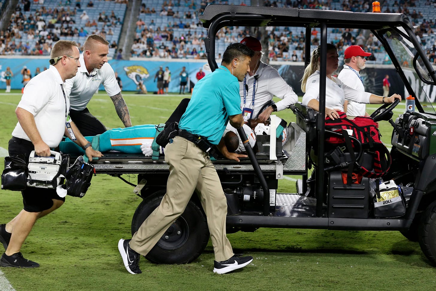 Miami Dolphins wide receiver Daewood Davis is carted off the field during the second half of an NFL preseason football game against the Jacksonville Jaguars, Saturday, Aug. 26, 2023, in Jacksonville, Fla. (AP Photo/Gary McCullough)