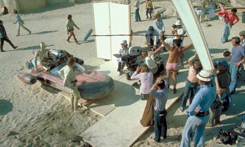 Ken Nightingall, holding boom mike and wearing pink shorts on the set of Star Wars Ken Nightingall, holding boom mike and wearing pink shorts on the set of Star Wars